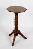 Shipbreakers timber. A turned wooden wine table, the planked octagonal shaped top with moulded edge,