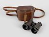 Boer War interest: a pair of Aldershot binoculars, in hand engraved hide case, inscribed: 'A.E.B. 19