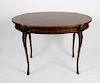 A good late Victorian mahogany inlaid centre table. The oval top having central inlaid motif within