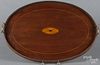 Hepplewhite style mahogany tray, early 20th c., with paterae inlay and a brass gallery, 18'' x 26''.