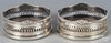 Pair of silver-plated wine coasters, early 20th c., 2 1/2'' x 5 1/2''.