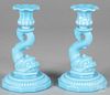 Pair of turquoise glass dolphin base candlesticks, 8'' h.