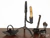 Iron lighting, 19th c., to include a grease lamp, a cruise lamp, and a rush light, 10 3/4'' h.