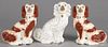 Pair of Staffordshire spaniels, 19th c., 12'' h., together with a single spaniel, 12 3/4'' h.