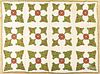 Pennsylvania floral appliqué quilt, late 19th c., with trapunto flower centers, 88'' x 64''.