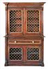Regency Faux Rosewood Painted Two Part Bookcase, having four grill work doors with metal mounts, height 77 inches, width 51 inches, depth 15 inches.