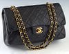 Chanel Classic Double Flap 26 Shoulder Bag, in black quilted lambkin calf leather with gold hardware, opening to a burgundy leather lined interior wit