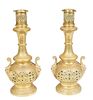 Pair of French Gilt Bronze Oil Lamps, 19th c., the everted neck over an incised socle to a pierced baluster base with two lions' head attached handles