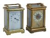 Two French Brass and Beveled Glass Carriage Clocks, early 20th c., with folding brass handles, one an alarm clock, running, with key; the second with 