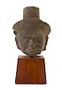 * A Khmer Limestone Head of Buddha Height 9 inches overall.