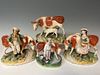 Four Staffordshire Cow Figurines