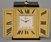 Cartier travel clock with black onyx top and bottom. 
ht.  2 1/8 in.