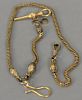 14K gold watch chain end with serpent head. 
33.3 grams