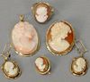 Six piece cameo lot including coral cameo medallion, brooch, pair of earrings, ring, and earring, in 14K settings. ring size 7