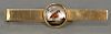 14K gold tie clip mounted with round glass with painted shore bird. 
ht. 2 3/4in. 10.2 grams