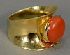 14K ladies ring set with oval coral. 
11.7 grams total weight