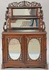Rosewood Victorian etagere with cabinet base and birdseye maple interior. ht. 63 in.; wd. 42 1/2 in.; dp. 18 in.Provenance: Being...