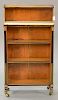 Satinwood and mahogany bookcase with inset marble brass trim and brass stop fluted quarter columns (marble crack). 
ht. 38 in.; wd. ...