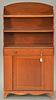 George IV mahogany shelf/cabinet with two shelves over drawer over door, all set on French feet. 
ht. 50 1/2 in.; wd. 24 in.; dp. 12...