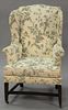 Federal upholstered wing chair on square tapered legs joined by stretchers, circa 1800.