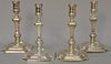 Set of four English silver candlesticks with turned and square shafts on modified square bases. ht. 8 1/4 in.; 81 t oz.