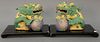 Pair of porcelain foo dogs on balls set on rectangular wood stands. 
lg. 8 1/2 in.; dia of shade 15 1/2 in.; ht. 7 1/2 in.; total ht...