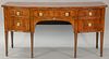 George III mahogany sideboard having banded inlaid bowed front top over center drawer flanked right by double drawer left by drawer ...