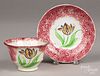 Red spatter cup and saucer with tulip
