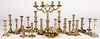 Group of brass candlesticks and candelabra