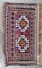 A Group of Three Rugs Largest 5 feet 10 inches x 3 feet 4 inches.