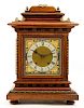 A Walnut and Brass Mantel Clock Height 18 inches.