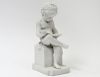 PARIAN-WARE FIGURE OF A BOY READING A BOOK