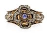 * A Victorian Gilt Metal, Sapphire and Multigem Bangle Bracelet, 30.80 dwts.