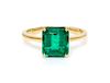 * An 18 Karat Yellow Gold and Emerald Solitaire Ring, 1.70 dwts.