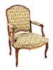 A Louis XV Style Walnut Fauteuil Height 37 1/4 inches.