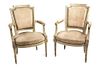A Pair of Louis XVI Style Painted Fauteuils Height 34 inches.