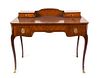 A Louis XVI Style Gilt Metal Mounted Lady's Writing Desk Height 34 3/4 x width 41 x depth 21 1/4 inches.