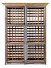 A Pair of Zinc and Mahogany Wine Storage Racks Height 85 x width 27 1/2 x depth 13 inches.