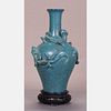 A Chinese Robin's Egg Blue Glazed Dragon Vase, 19th Century.