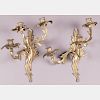A Pair of Louis XV Style Gilt Brass Three Arm Wall Sconces 20th Century.