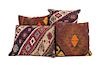 * A Collection of Four Kilim Upholstered Pillows Height of largest 16 inches.