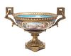 * A Sevres Style Gilt Bronze Mounted Porcelain Center Bowl Height 9 1/2 x diameter 16 1/2 inches.