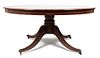 An English Mahogany Round Dining Table Height 29 1/2 x diameter 65 1/2 inches.