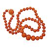 A DEEP SALMON COLORED CORAL BEAD NECKLACE