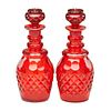 PAIR OF RUBY GLASS DECANTERS