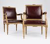 A pair of Louis XVI-style beechwood armchairs