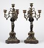 Pair of Continental patinated bronze candelabra
