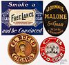 Four hanging paper cigar signs