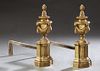Pair of French Neo Classical Gilt Bronze and Iron Chenets, 19th c., with flame topped garland draped urns on reeded columnar supports, on stepped reli