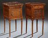 Near Pair of French Louis XVI Style Carved Walnut Marble Top Nightstands, 20th c., the inset highly figured brown marble over a frieze drawer and a lo